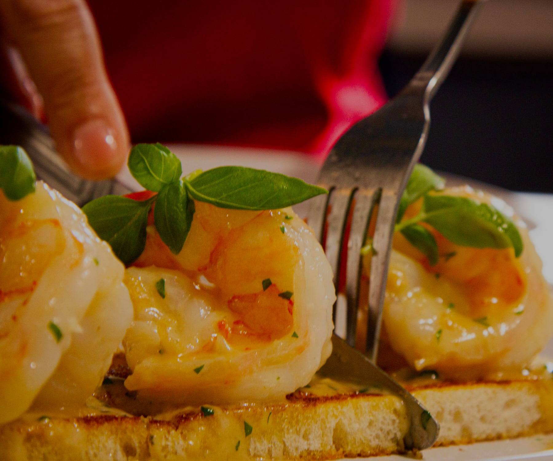 Plump sautéed jumbo shrimp on toasted sourdough, garnished with microgreens